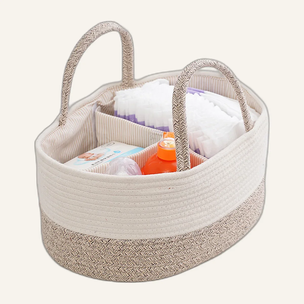 Ivory and taupe cotton rope nappy caddy filled with nappies