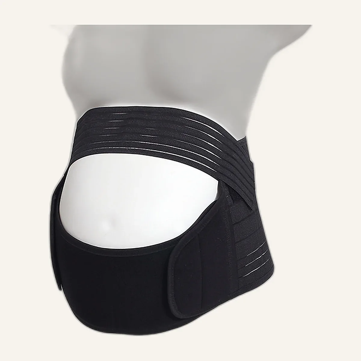 Black maternity support belt worn under a pregnant bump