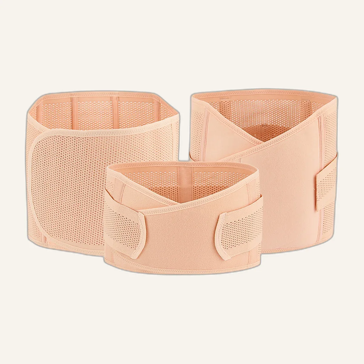 Three nude postpartum belly bands laid flat